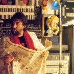 Vangelis with a newspaper.png